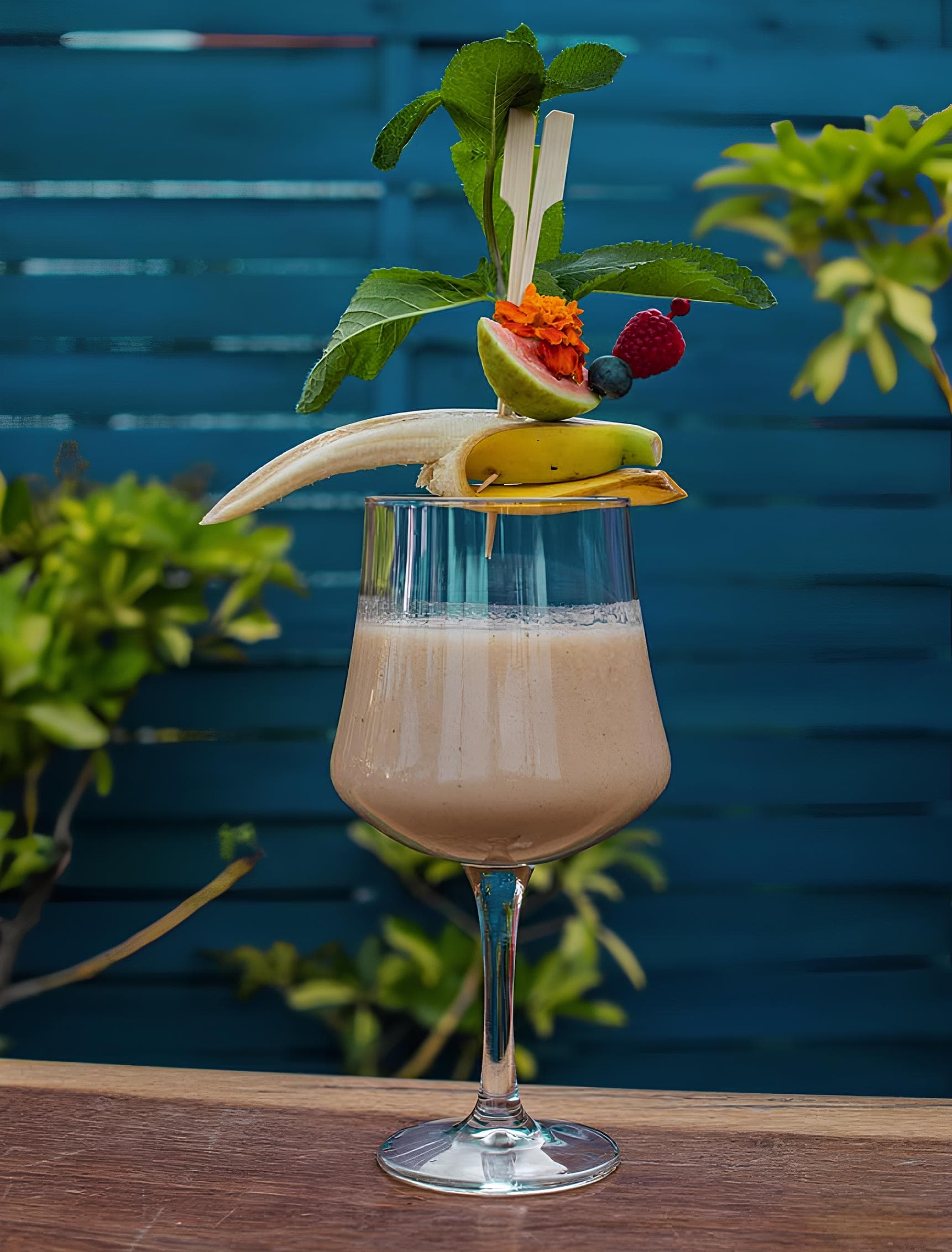 Premium tropical cocktail with tropical fruit garnish at Astral Bar Puerto Banús
