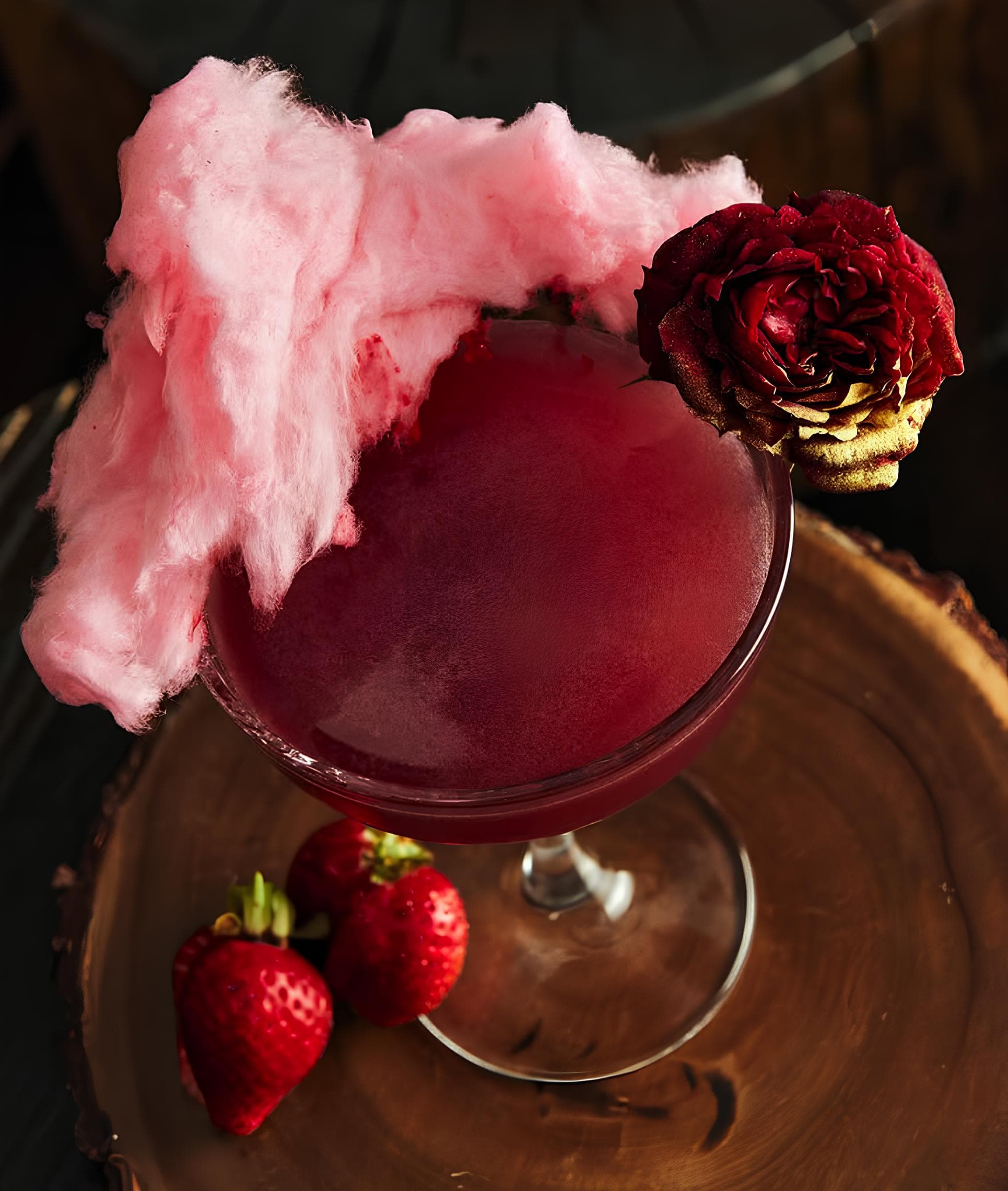 Signature pink cocktail with cotton candy garnish at the galleon bar in Marbella
