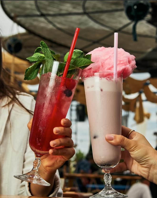 Colorful tropical cocktails served at waterfront Astral Bar terrace